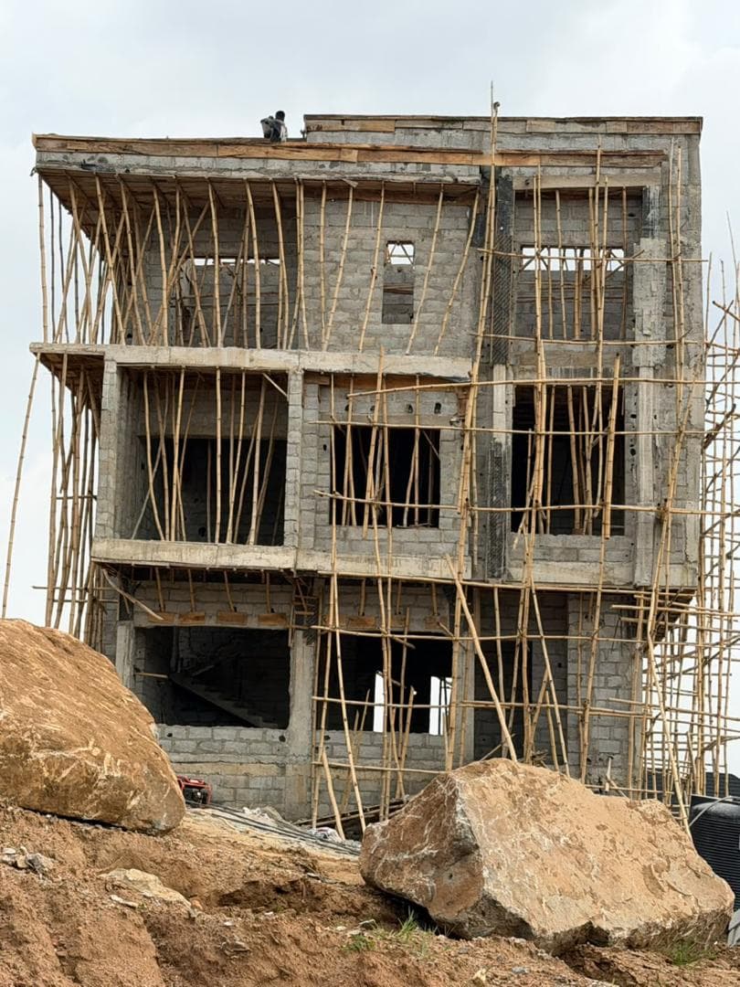 Front elevation with floor slabs cast and openings formed through both upper levels