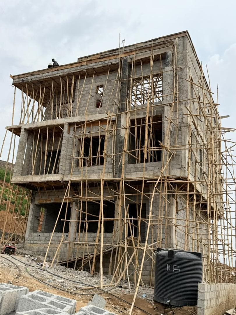 Corner view showing the column grid and cantilevered slab edges above the ground floor