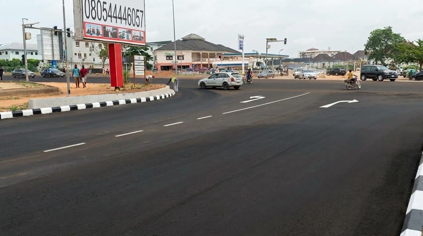 Junction approach with directional arrows and kerbs finished to the median